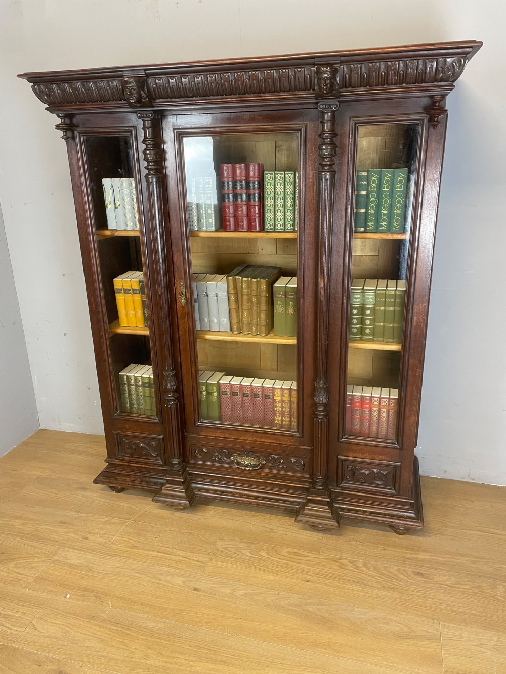 C19TH carved freestanding glazed walnut bookcase  View II