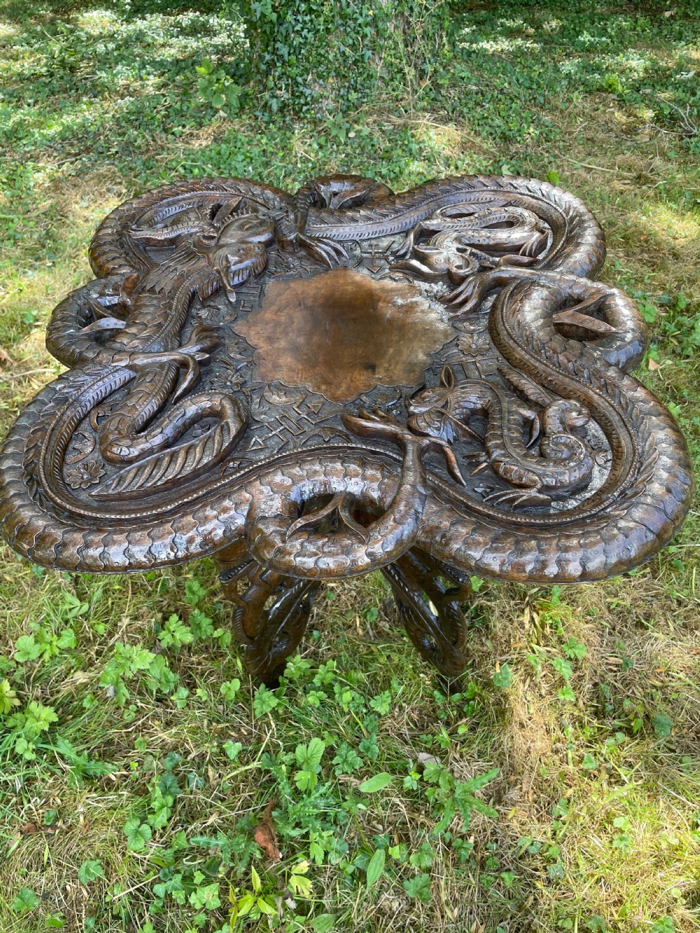 Late C19TH carved Burmese dragon table  View II
