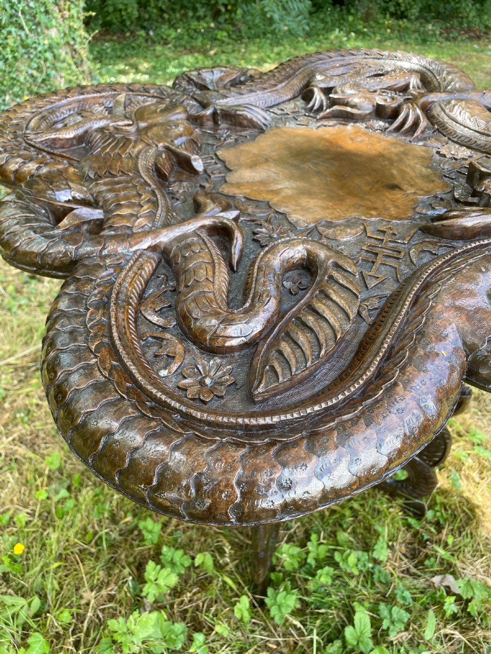 Late C19TH carved Burmese dragon table  View III