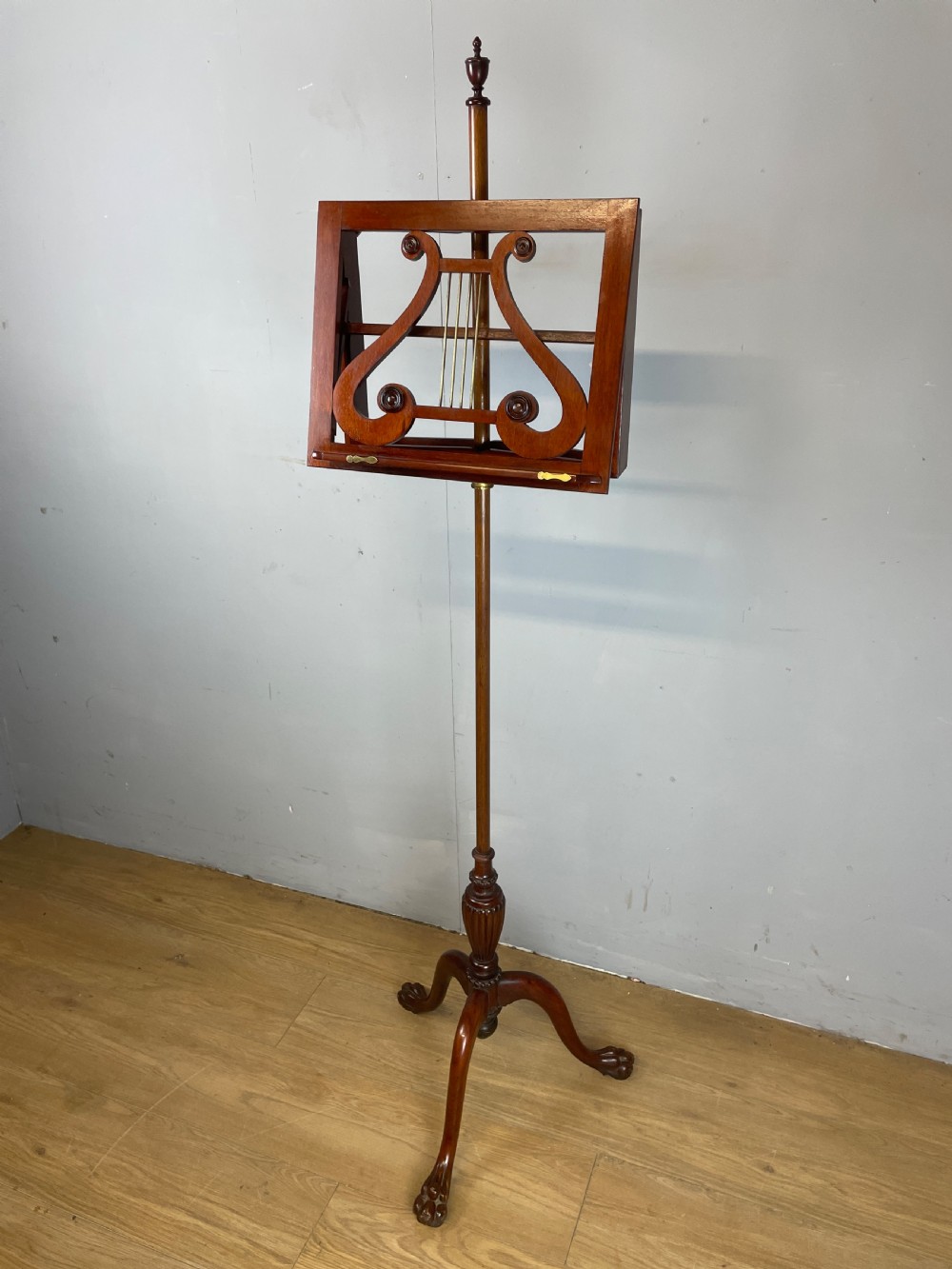 Late C19TH mahogany music stand on a tripod base 