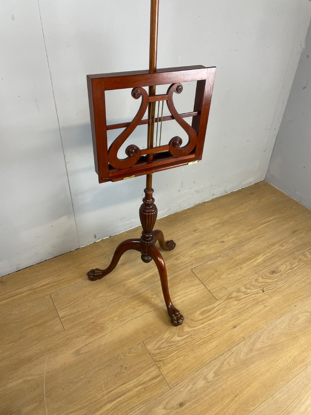 Late C19TH mahogany music stand on a tripod base  View XII