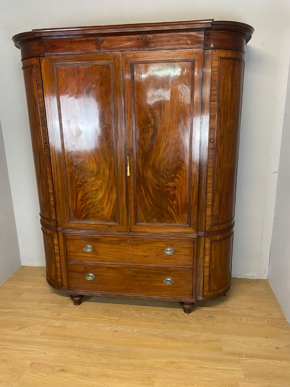 C19TH country house flame mahogany bow fronted and breakfront wardrobe  View II