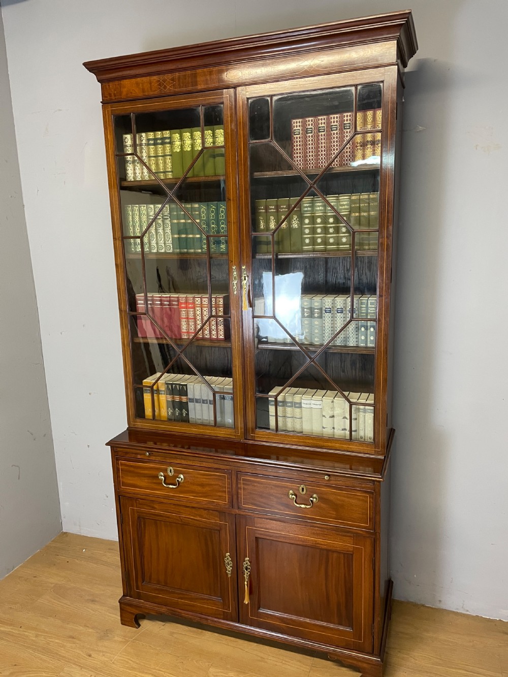 C19TH Sheraton revival inlaid mahogany bookcase over cupboard  View II