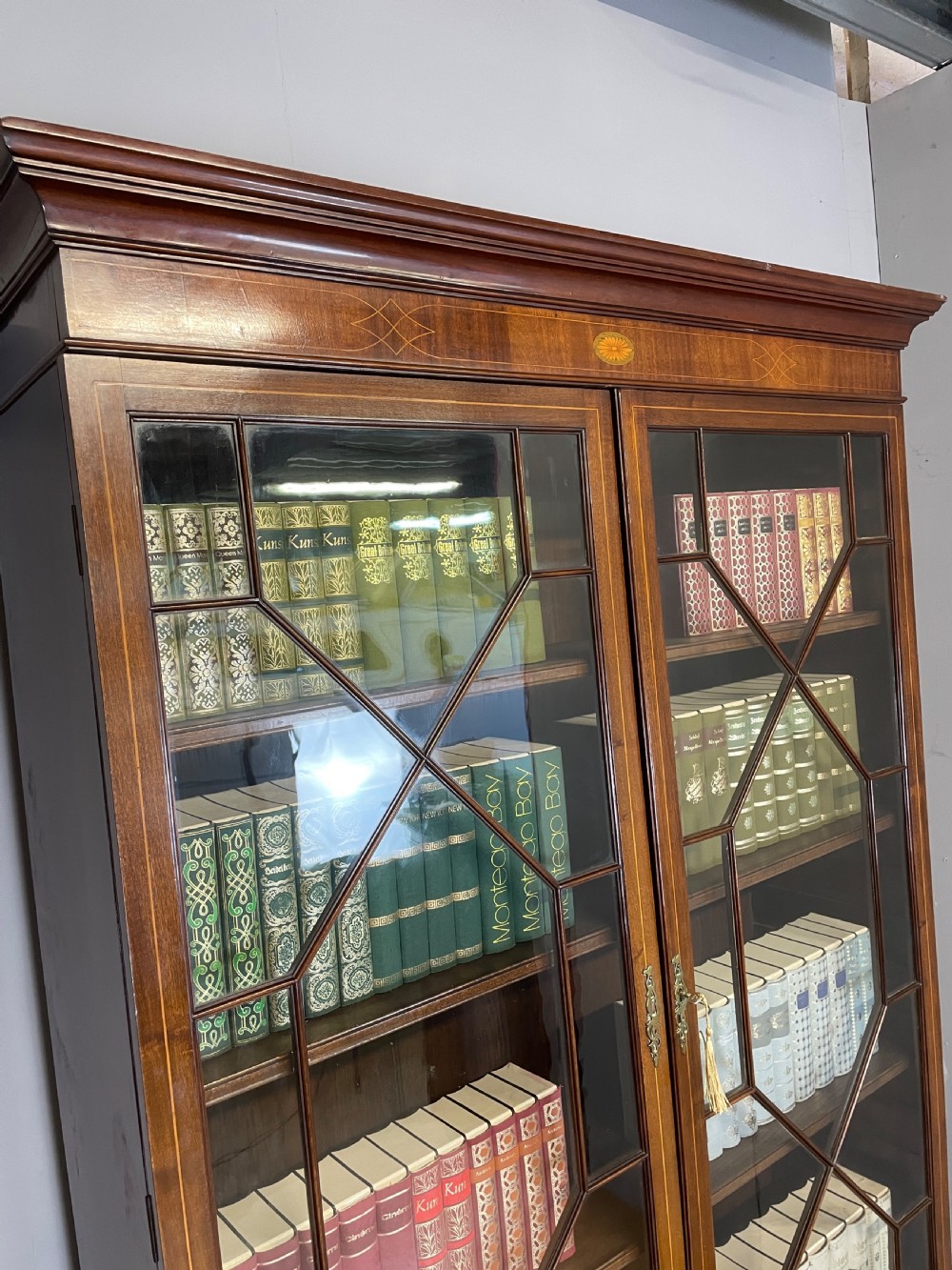 C19TH Sheraton revival inlaid mahogany bookcase over cupboard  View III