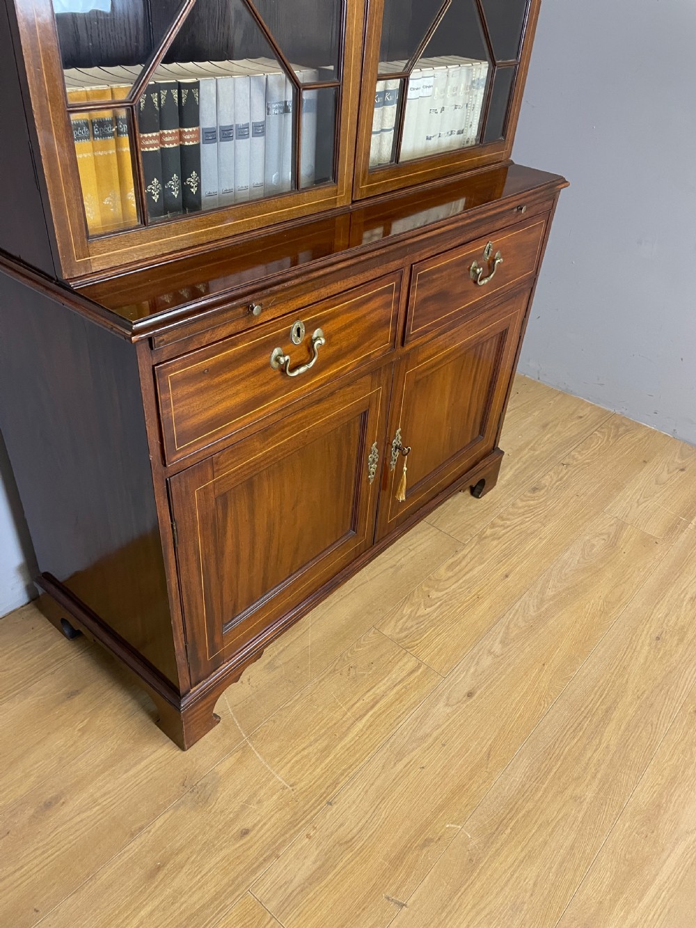 C19TH Sheraton revival inlaid mahogany bookcase over cupboard  View V