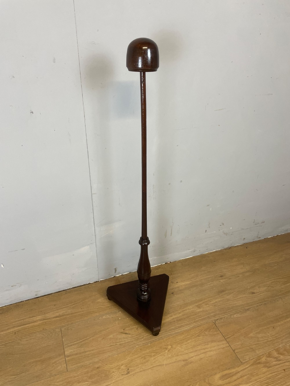 Regency mahogany wig stand on tripartite base 