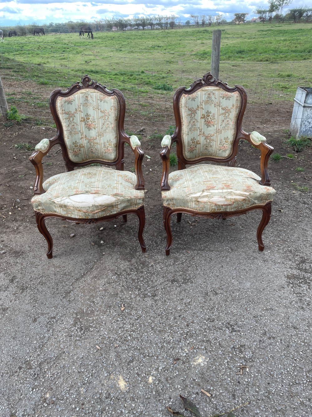 Pair of French Louis XV style Fauteuils chairs in worn country house condition 