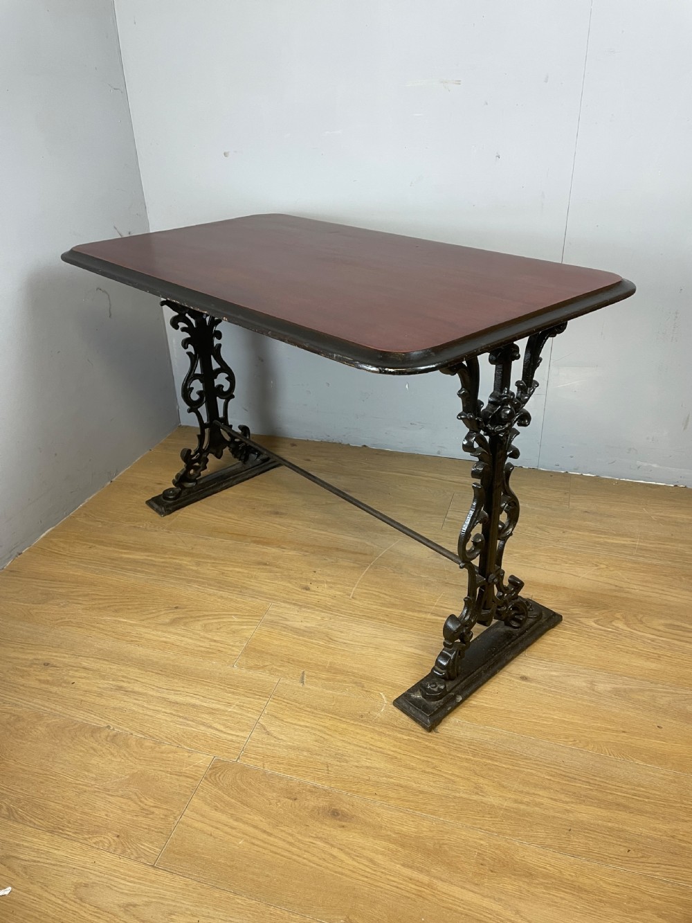 Victorian cast iron pub table with mahogany top 