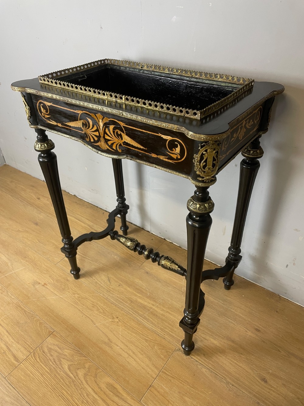 A 19th-century ebonised rectangular jardiniere table featuring intricate marquetry inlay, gilt-bronze mounts, turned legs, and a pierced brass gallery. View II