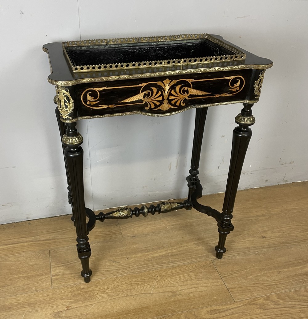A 19th-century ebonised rectangular jardiniere table featuring intricate marquetry inlay, gilt-bronze mounts, turned legs, and a pierced brass gallery. View IV