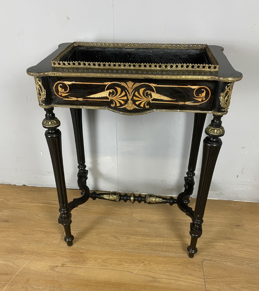 A 19th-century ebonised rectangular jardiniere table featuring intricate marquetry inlay, gilt-bronze mounts, turned legs, and a pierced brass gallery. View V