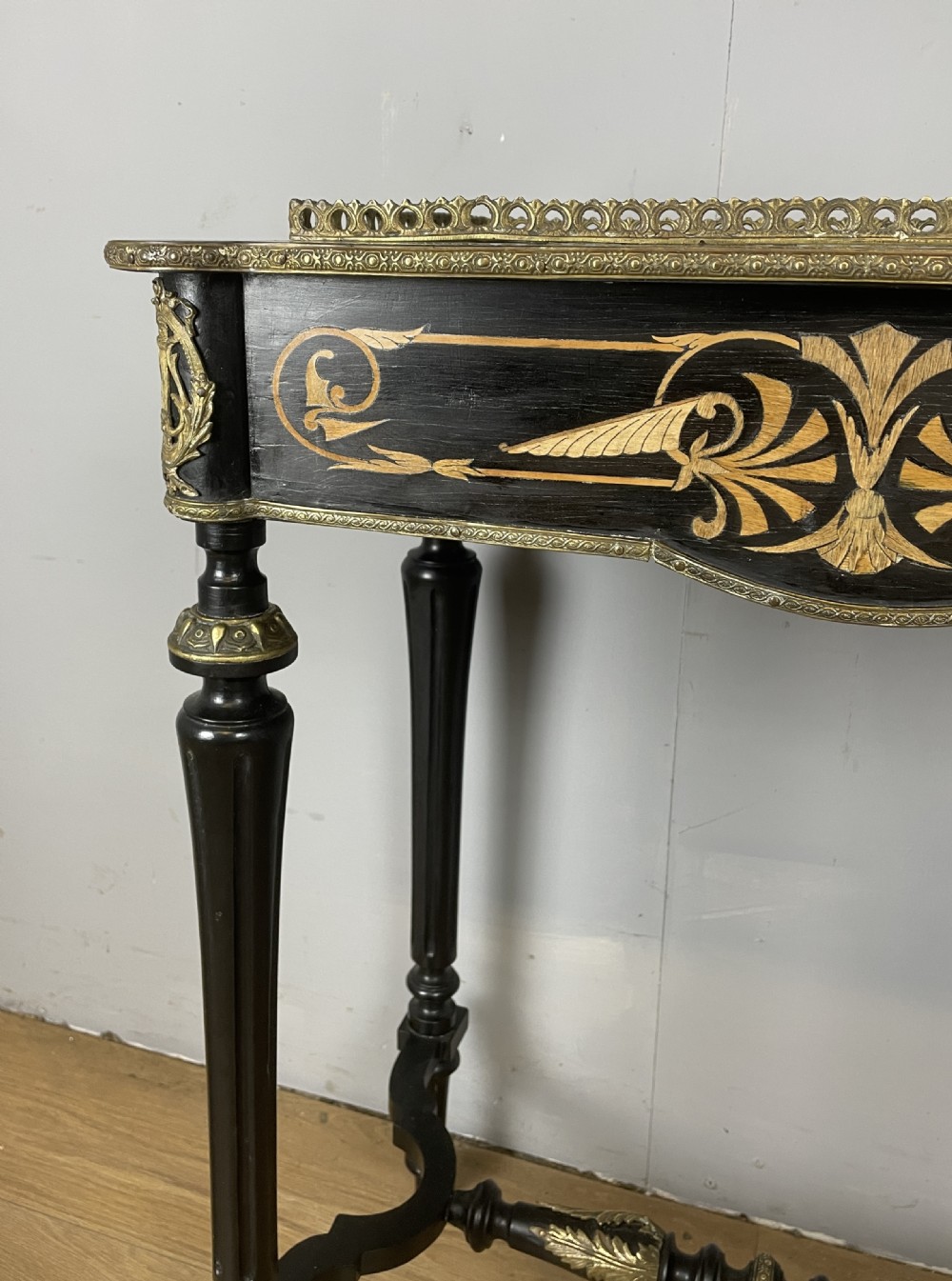 A 19th-century ebonised rectangular jardiniere table featuring intricate marquetry inlay, gilt-bronze mounts, turned legs, and a pierced brass gallery. View IX
