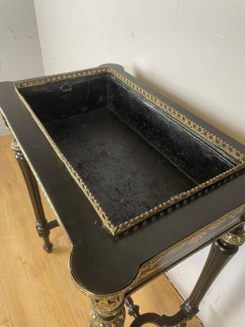 A 19th-century ebonised rectangular jardiniere table featuring intricate marquetry inlay, gilt-bronze mounts, turned legs, and a pierced brass gallery. View XI