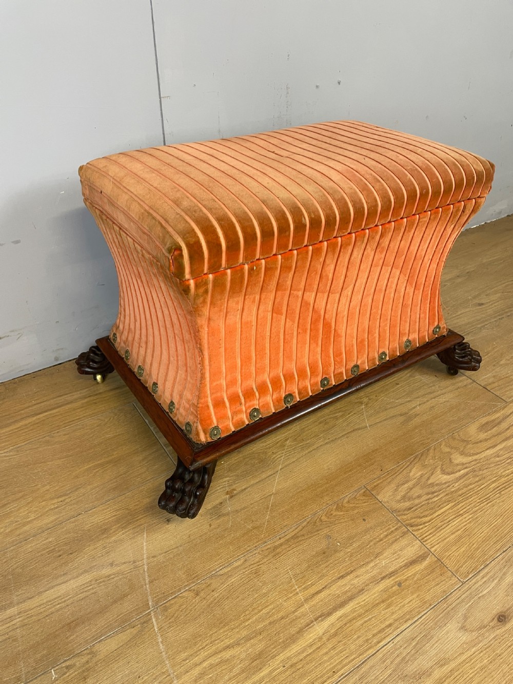 Late Regency sarcophagus shaped ottoman on carved feet  View II