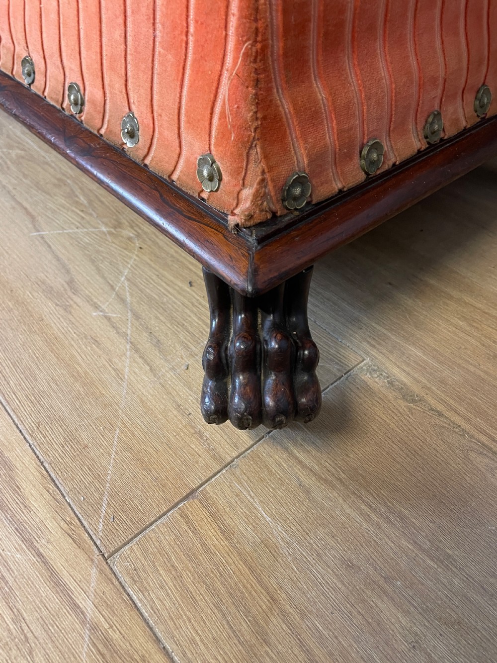 Late Regency sarcophagus shaped ottoman on carved feet  View III