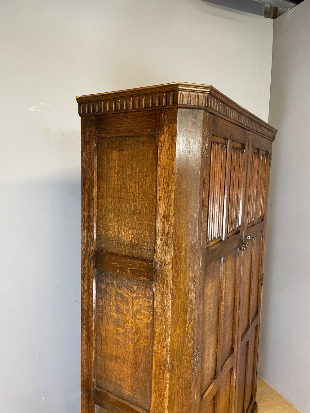 Early C20th linen fold oak hall cupboard  View XI