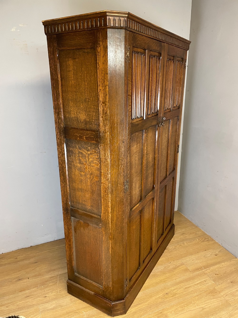 Early C20th linen fold oak hall cupboard  View XII