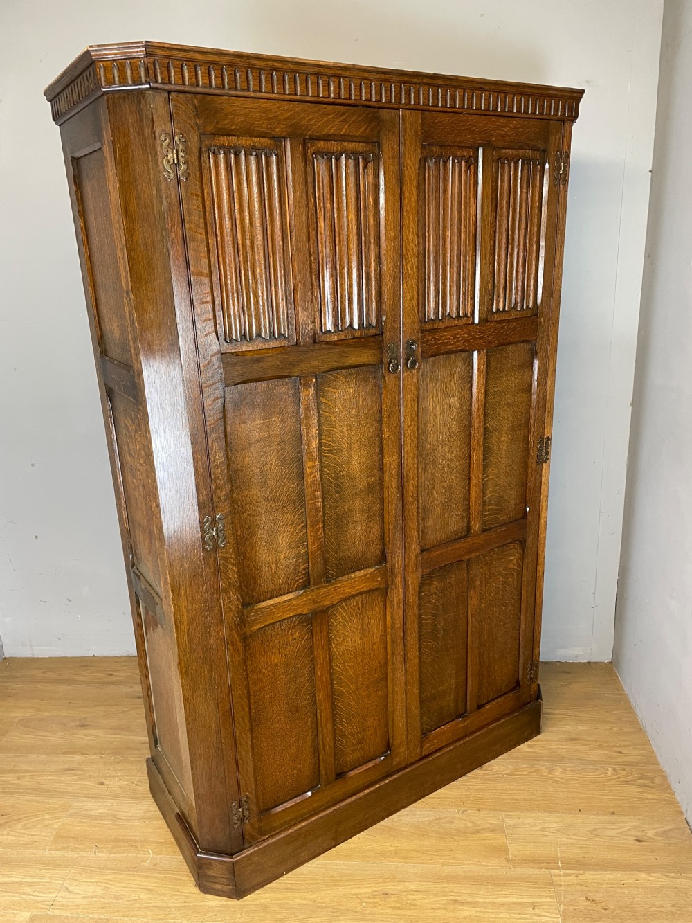 Early C20th linen fold oak hall cupboard  View XIV