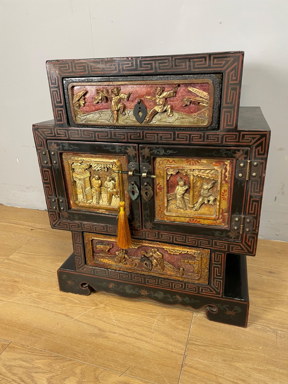 Chinese gilt and black lacquered cabinet  circa 1910