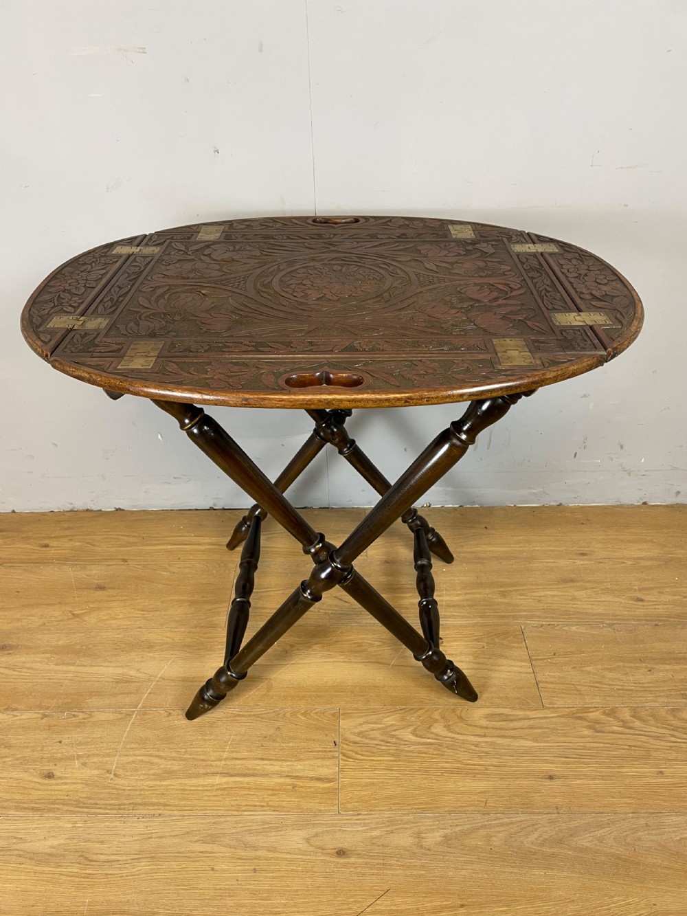 Arts and crafts carved walnut butlers tray on stand 