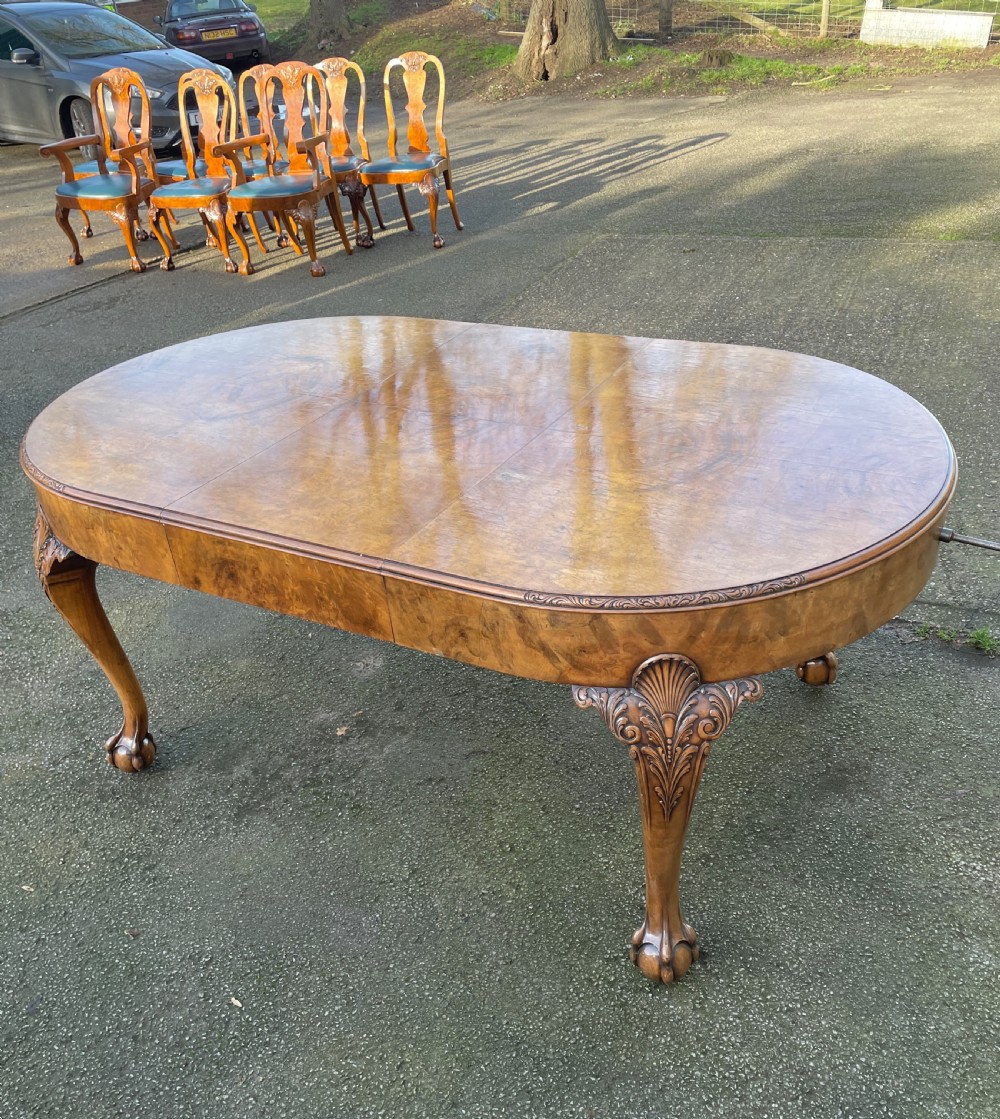 Burr walnut Queen Anne 8 seater wind out table and eight chairs by Charles Walker of Harrogate  View XXV