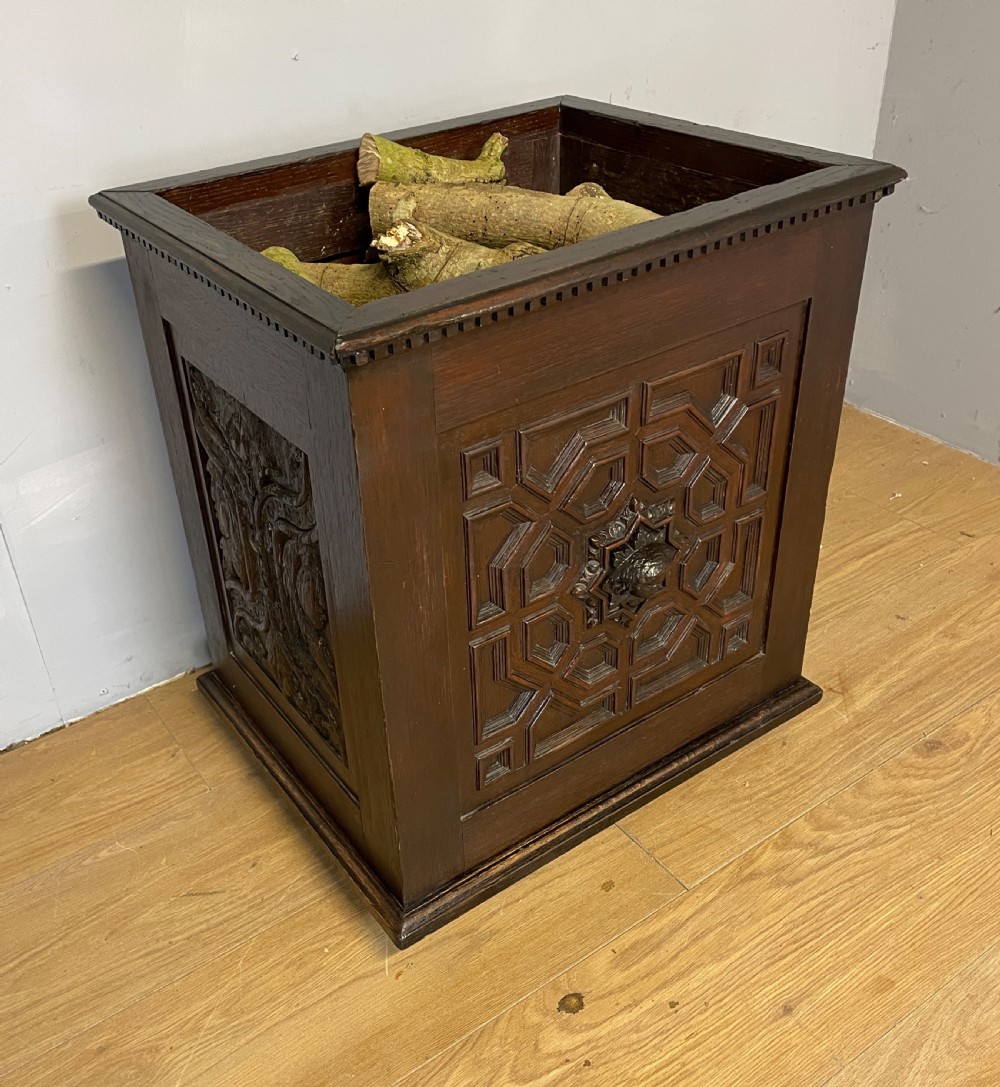 C19TH solid oak carved log bin in Jacobean style  View II