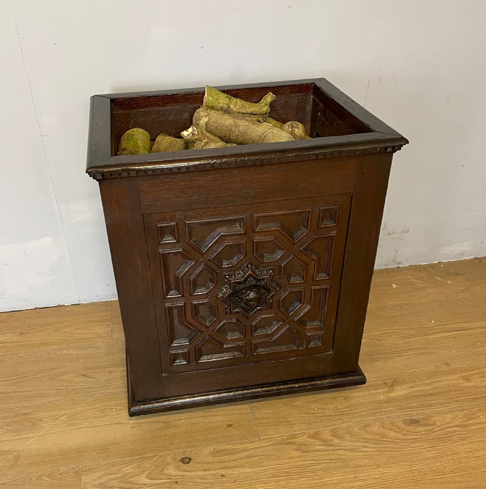 C19TH solid oak carved log bin in Jacobean style  View III