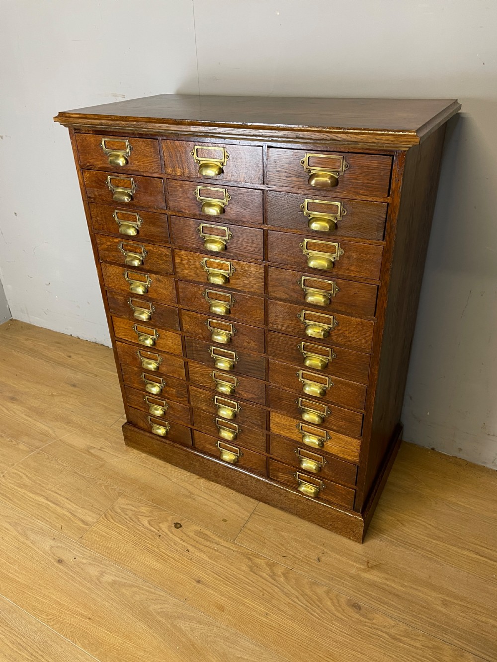 Edwardian cabinet of 33 oak filing drawers 