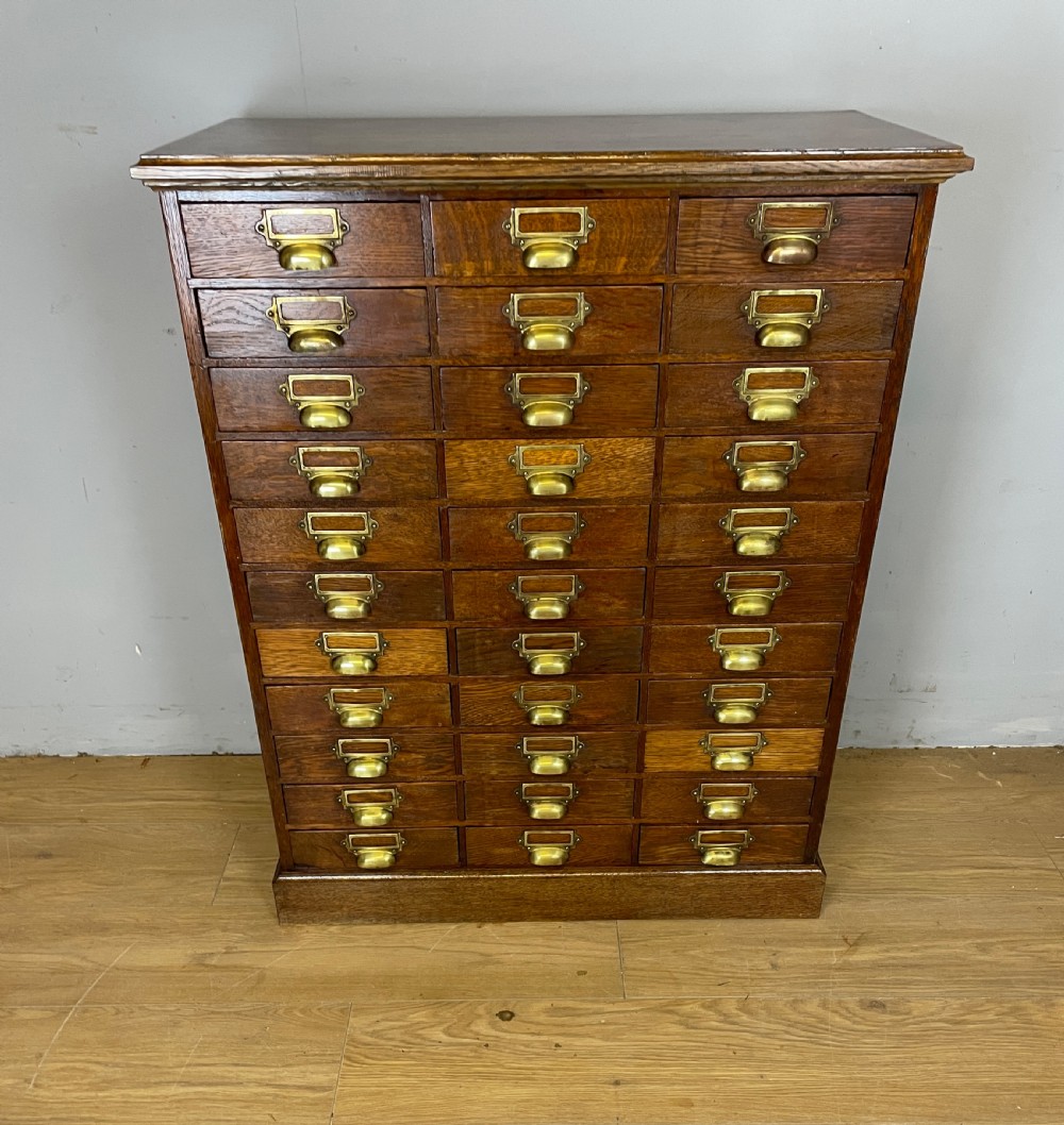 Edwardian cabinet of 33 oak filing drawers  View III