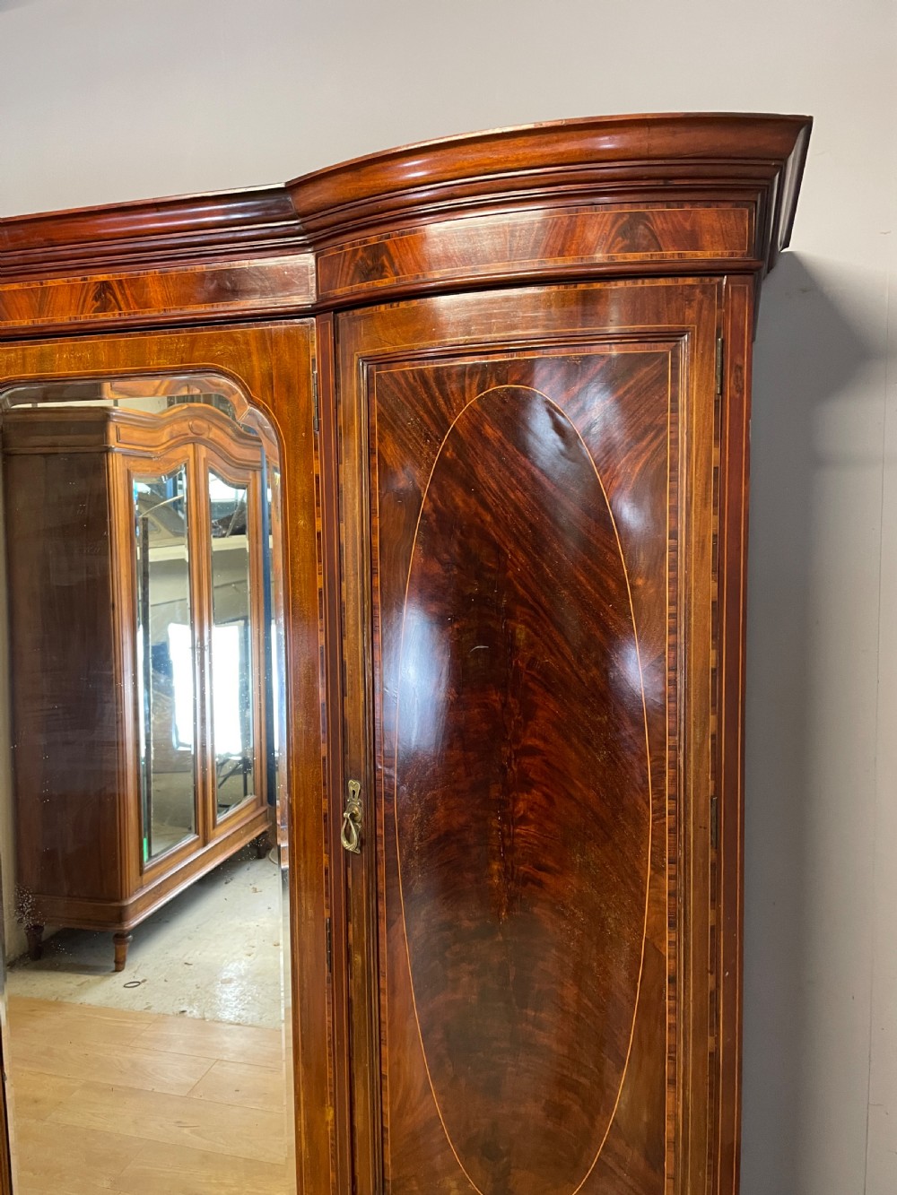 C19TH flame mahogany inlaid triple bow front wardrobe  View II