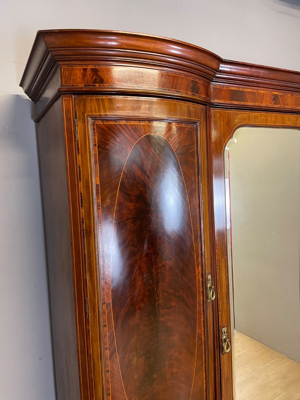 C19TH flame mahogany inlaid triple bow front wardrobe  View III
