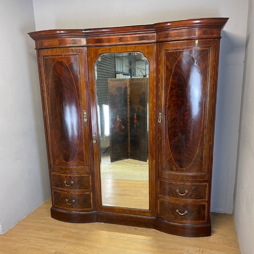 C19TH flame mahogany inlaid triple bow front wardrobe  View IV
