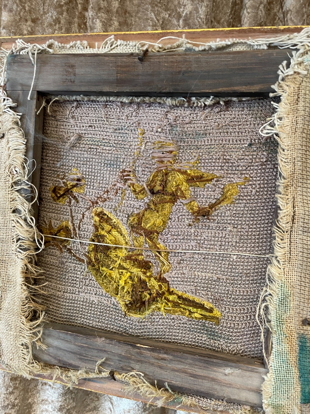 A pair of gilt-framed 19th-century needlework pictures featuring classical figures stitched in gold thread against a blue backdrop. View VIII