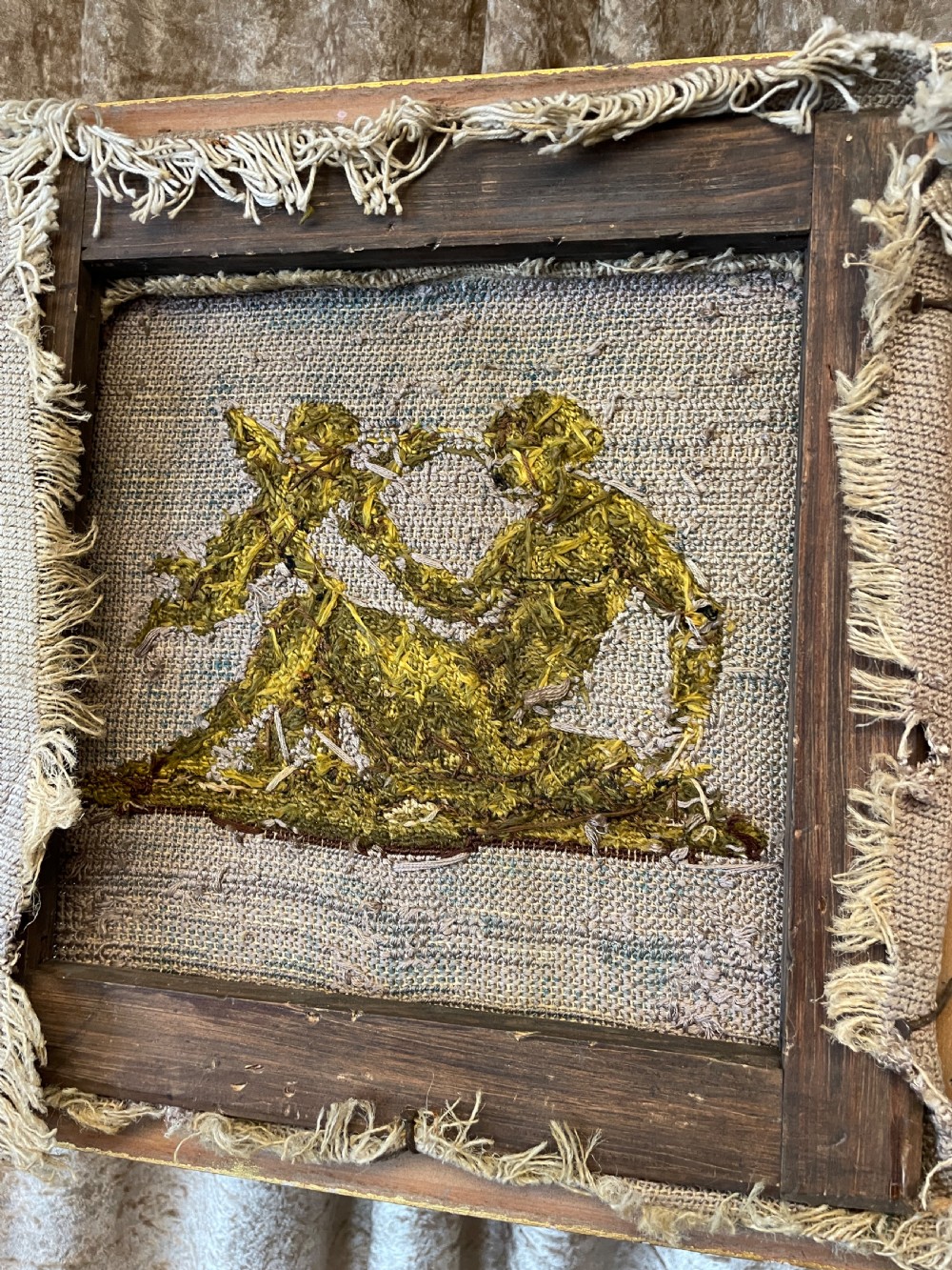 A pair of gilt-framed 19th-century needlework pictures featuring classical figures stitched in gold thread against a blue backdrop. View IX