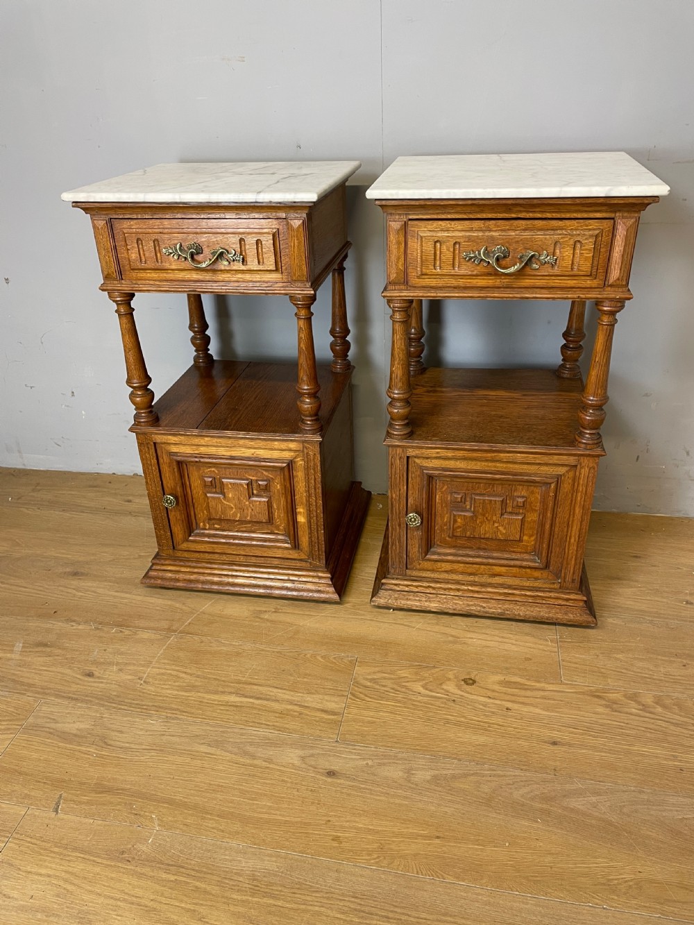 C19TH pair of French oak bedside cabinets with marble tops 