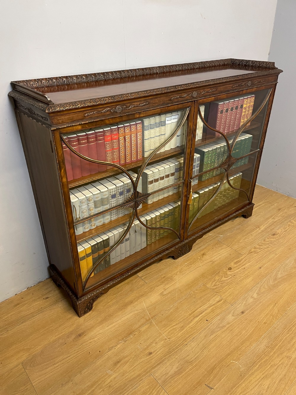 Edwardian carved Georgian style mahogany freestanding glazed bookcase  View XVII