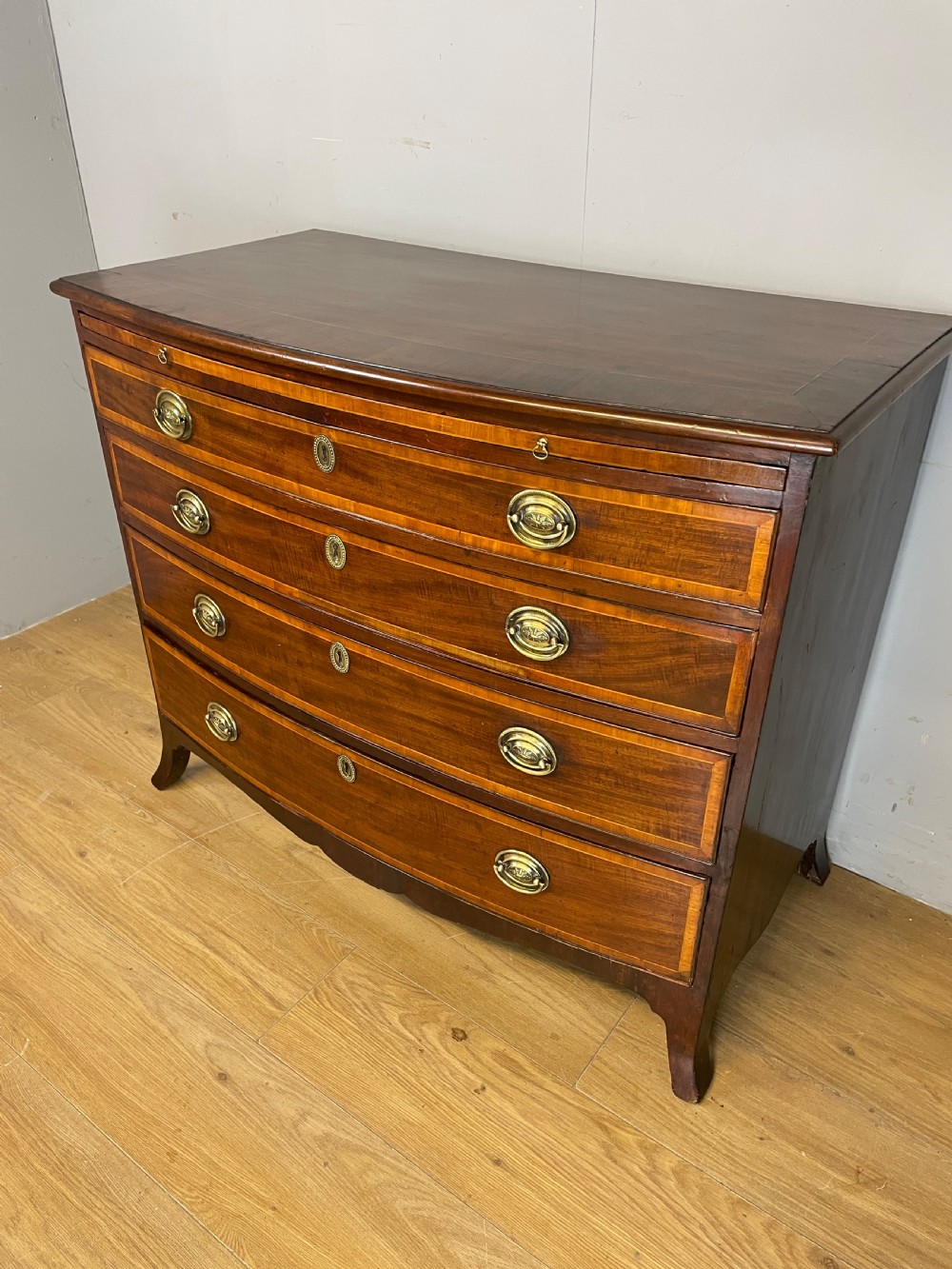 Georgian inlaid mahogany bow front chest of drawers  View II