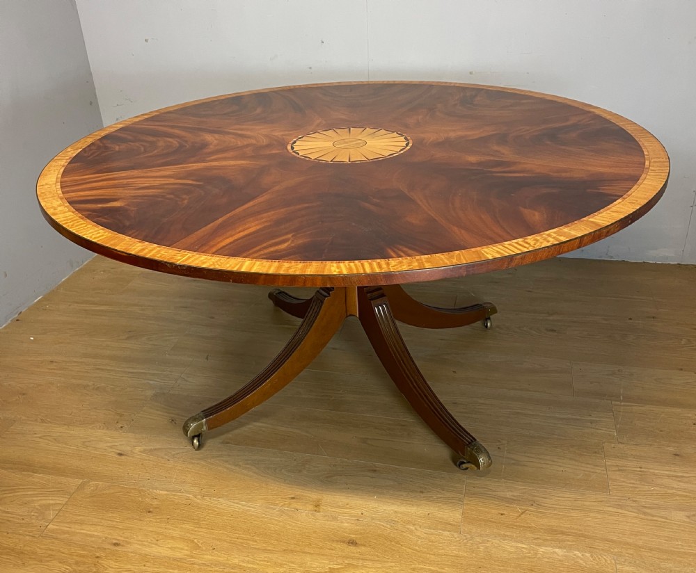 Flame mahogany regency style circular dining table circa 1920