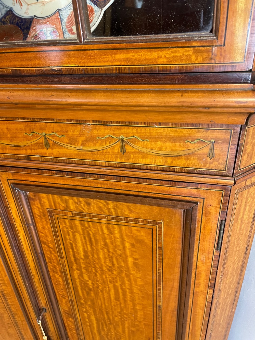C19TH Sheraton revival painted and inlaid satinwood standing corner cupboard  View IV