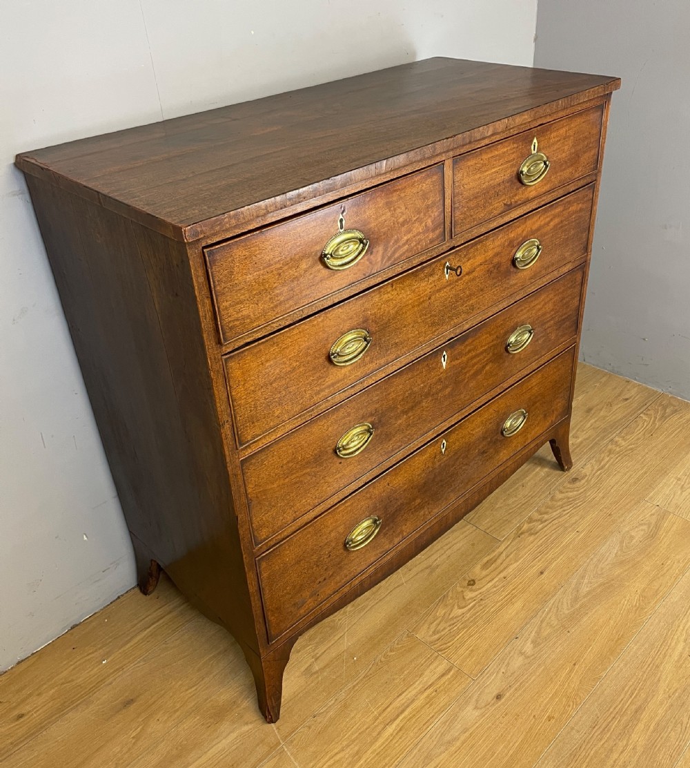George III mahogany chest of drawers on splayed feet  View II