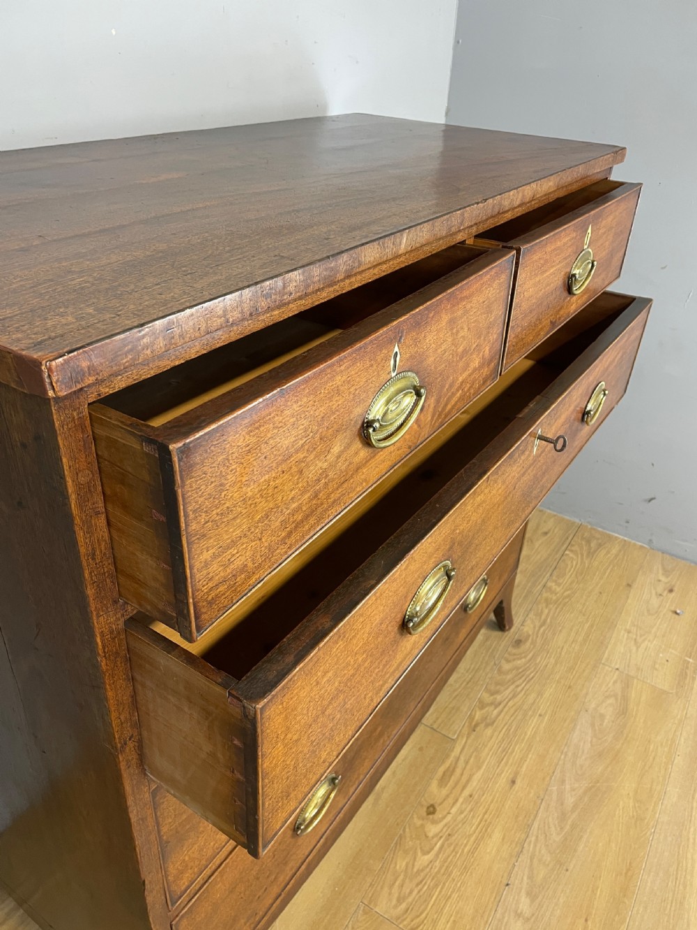George III mahogany chest of drawers on splayed feet  View IX