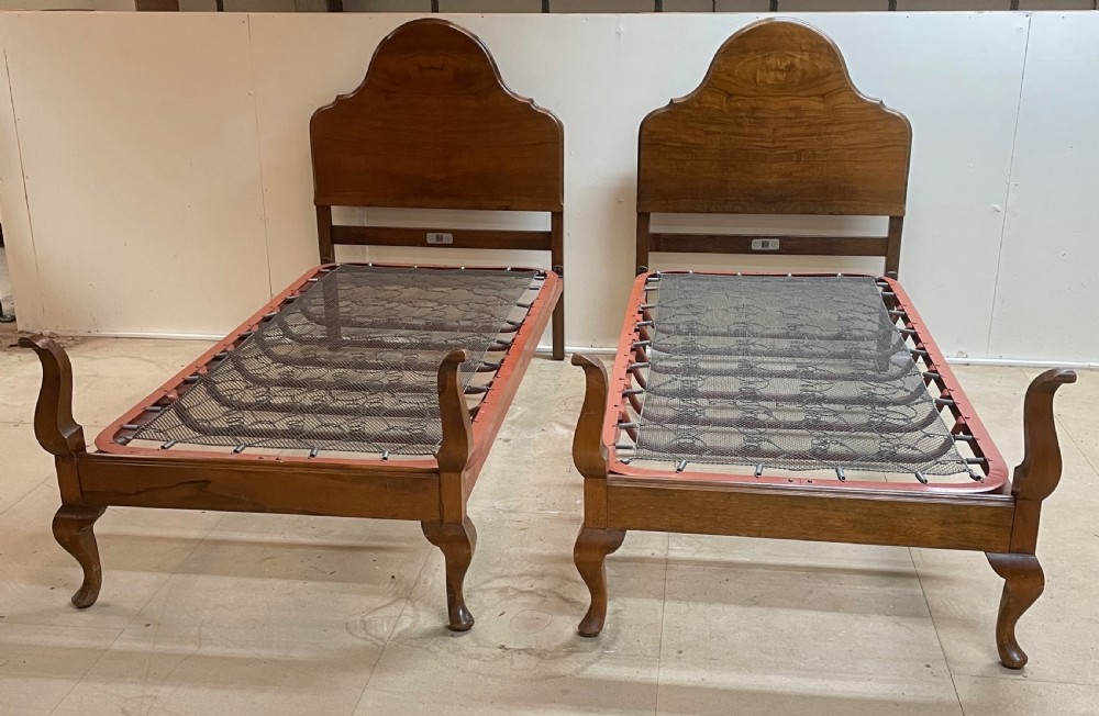 Early C20th pair of walnut single beds by Staples and Co