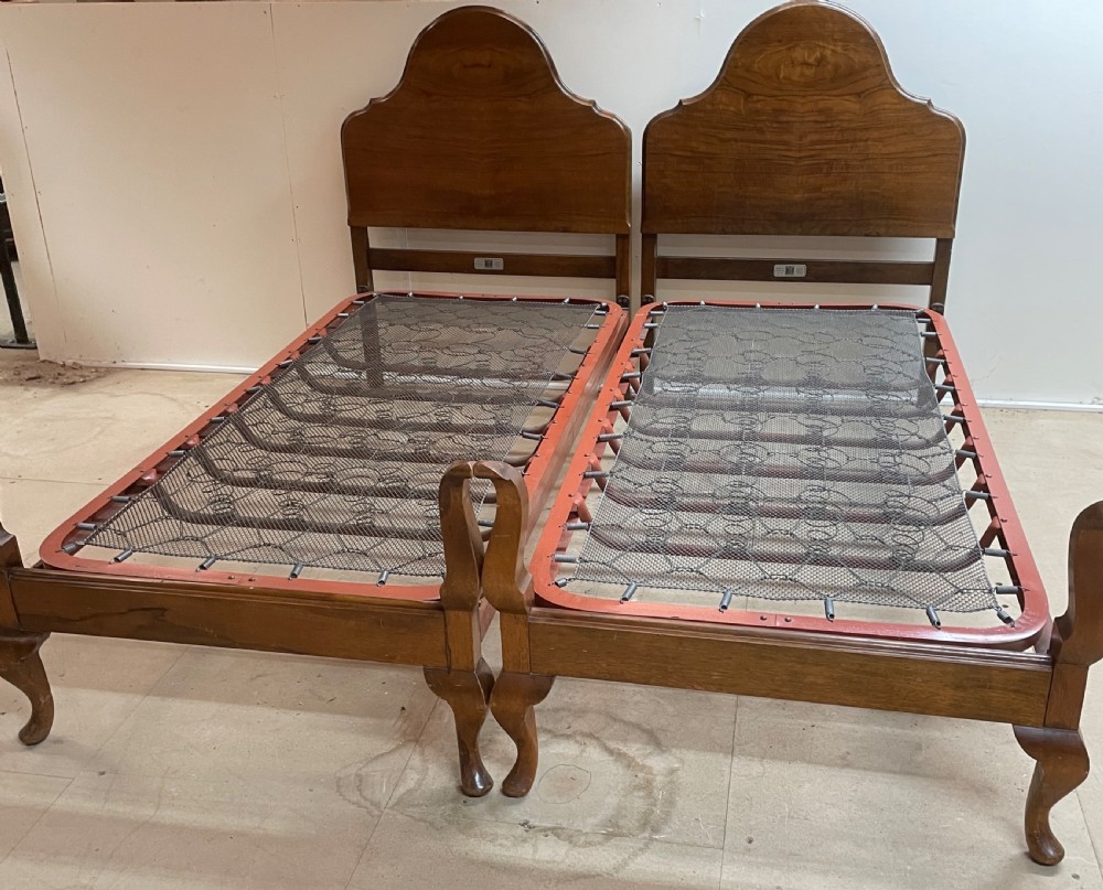 Early C20th pair of walnut single beds by Staples and Co View XI