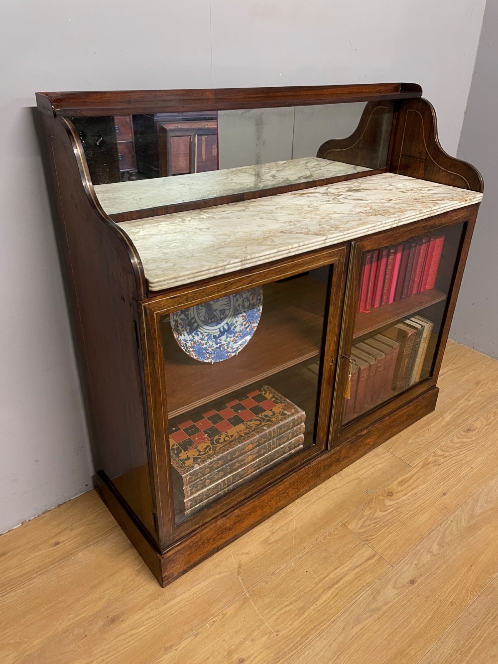 Regency rosewood brass inlaid marble topped bookcase circa 1820