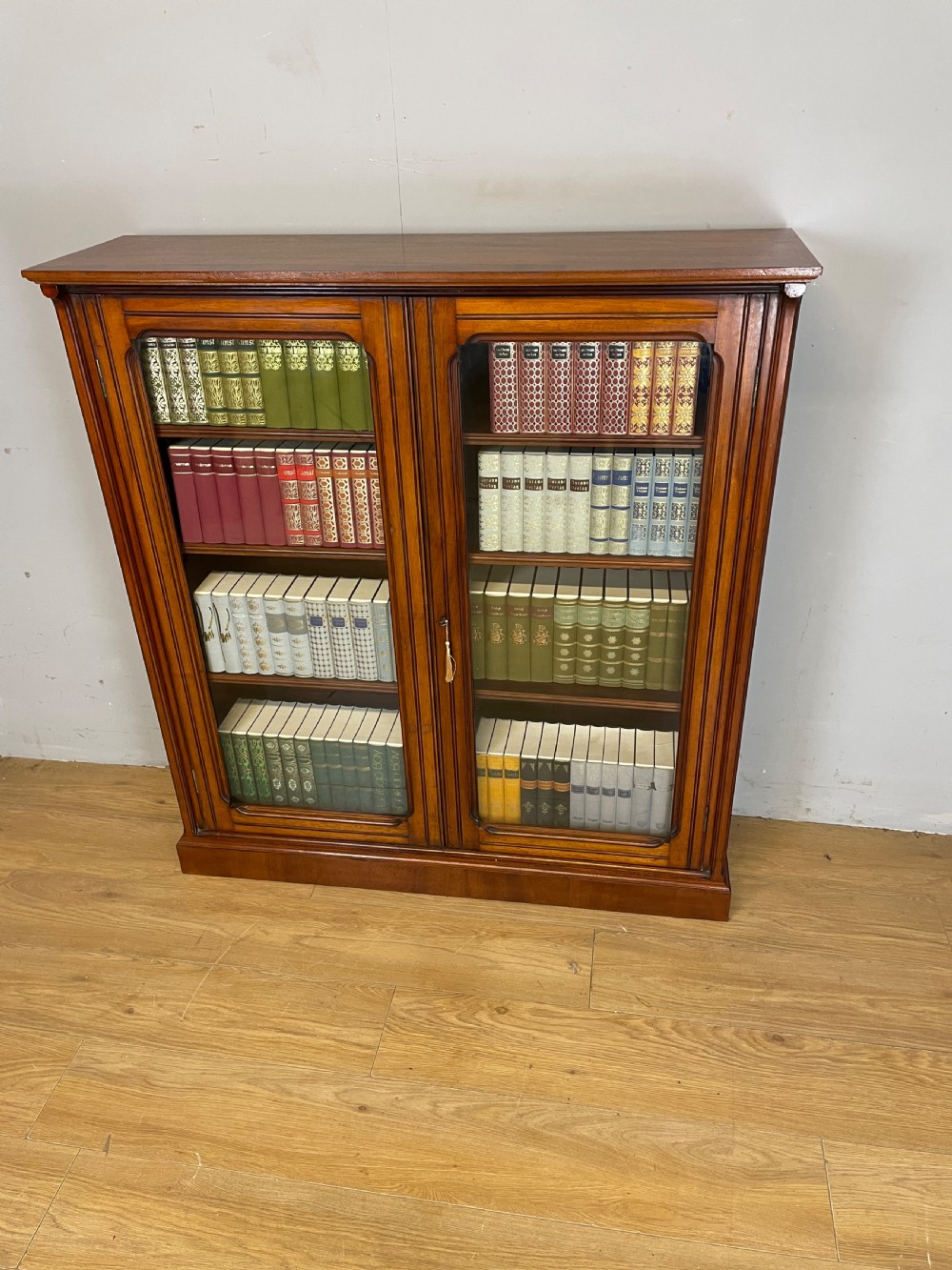 Arts and Crafts walnut freestanding glazed bookcase View II