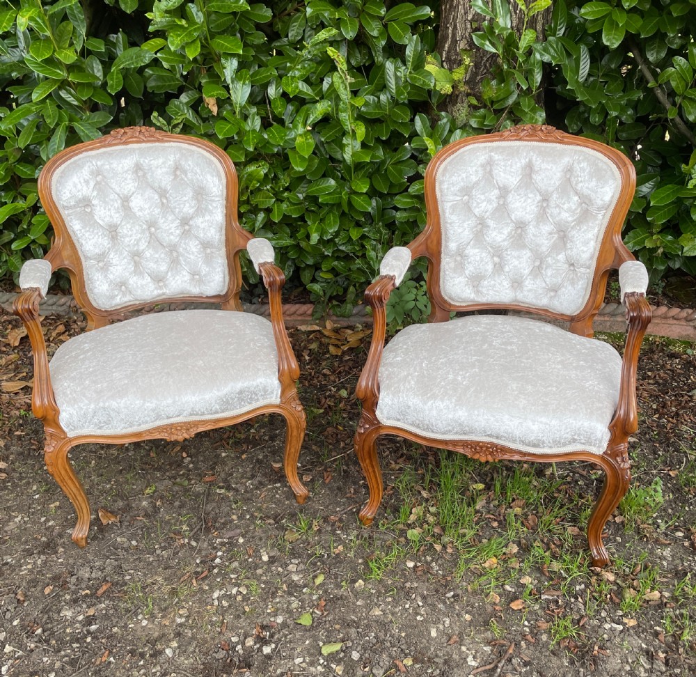 Pair of solid walnut Louis Quinze style armchairs 