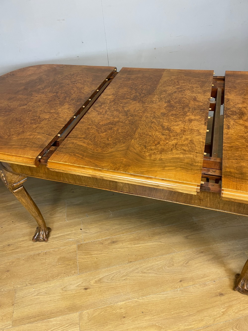 Burr walnut extending Queen Anne style six seater dining table  View IX