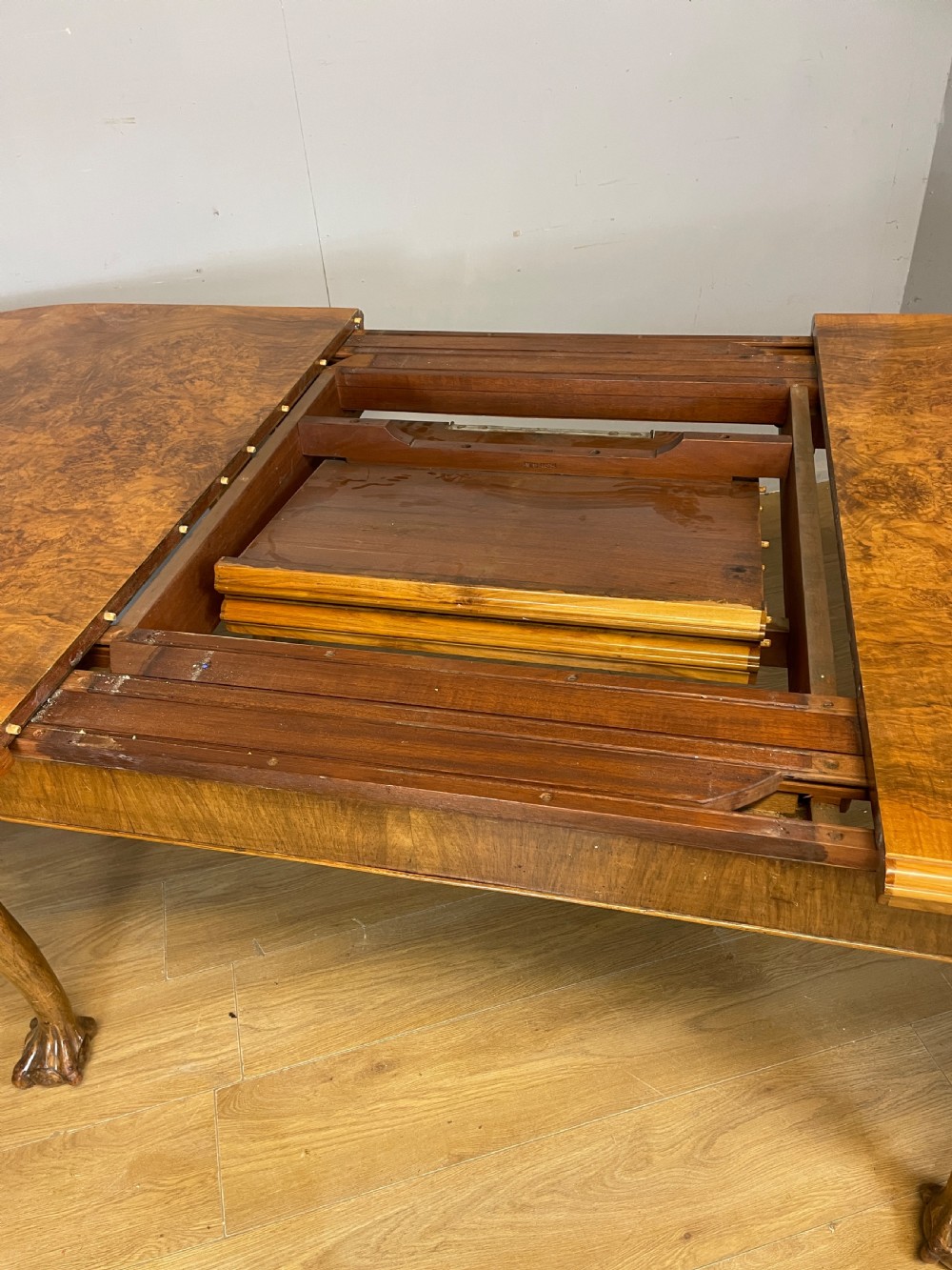 Burr walnut extending Queen Anne style six seater dining table  View XI