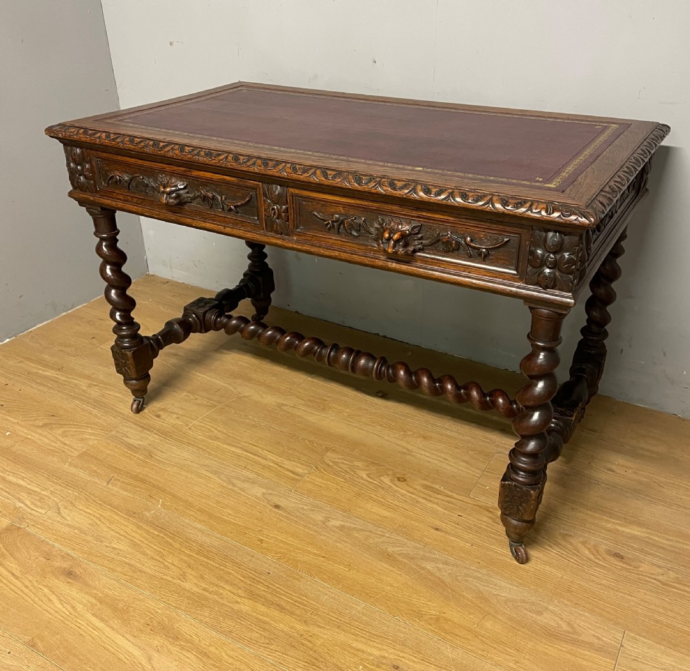 C19th Carved Oak Jacobean style writing Table With tooled leather top  View II