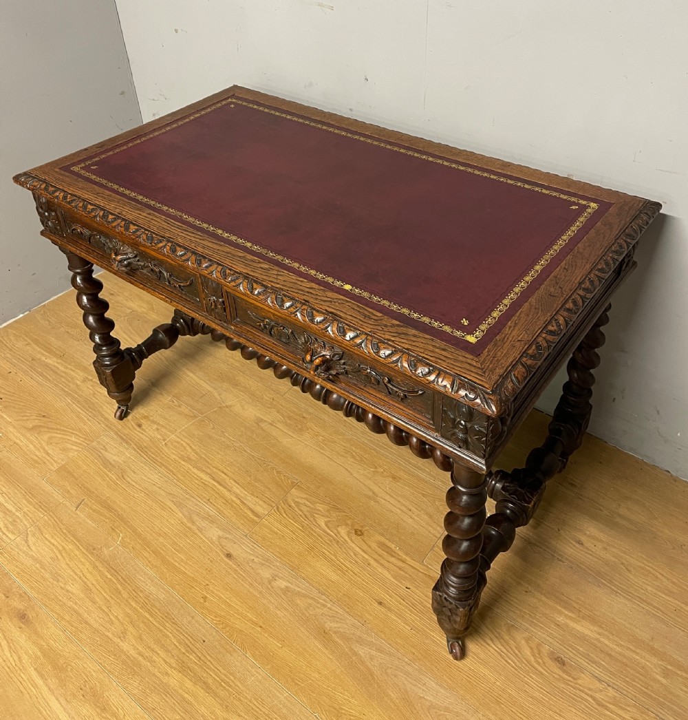 C19th Carved Oak Jacobean style writing Table With tooled leather top  View III